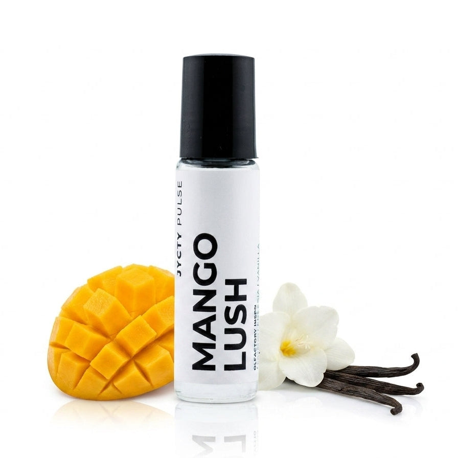 A 10ML ROLL ONbottle of JYCTY Pulse Mango Lush body spray with a black cap, styled with a sliced mango, vanilla flower, and vanilla beans on a white background.