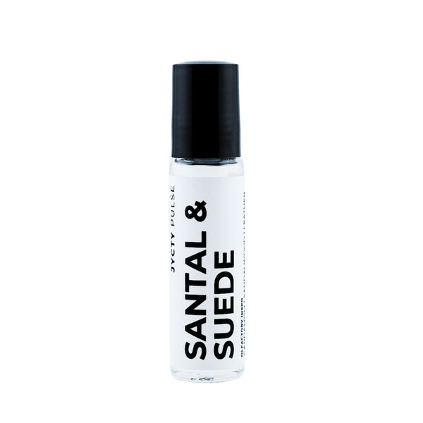 Roll-on bottle of Santal & Suede perfume with black cap on a white background