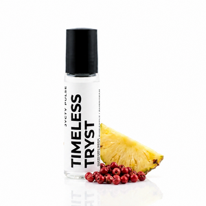 A clear cylindrical roll-on bottle with a black cap and white label reading 'TIMELESS TRYST' and 'JYCTY PULSE', shown on a white background with a pineapple slice and red berries as flavor props.